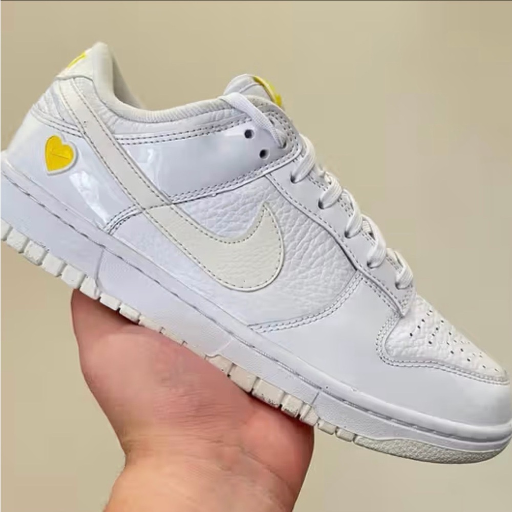 Nike Dunk White Sneakers with Yellow Heart Accent